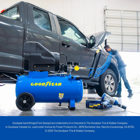 Kickass Oil Free Portable Air Compressor 8 Gallon Horizontal Tank 150 PSI Max Pressure in garage with dark gray truck.
