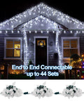 House decorated with Faceted Green C9 Christmas String Lights With 50 LEDs And 24.5 Foot Connectable Length Indoor Outdoor UL Certified Light Strand For Holiday Decor Patio Parties And St Patrick Day Cheer, end to end connectable feature displayed.