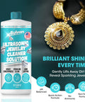 Ultra Strong 32 Oz Ultrasonic Jewelry Cleaner Solution next to shining gold jewelry, highlighting its cleaning power for delicate items.