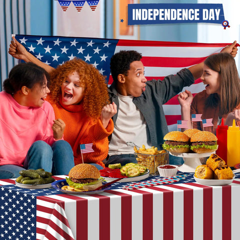 People celebrating with Patriotic Fourth Of July Tablecloth Set Two Pack 54 By 108 Inches Plastic Outdoor Party Cover with American Flag Design.