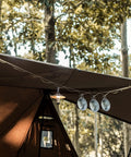 Heavy Duty Camping Lanyard Ten Feet With 19 Loops Daisy Chain Gear Hanger suspending cups and lantern under tent canopy at campsite