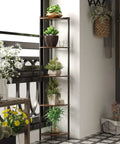Five Tier Corner Shelving Unit Super Sturdy Storage Rack with plants displayed in a compact corner setup.