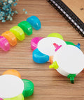 Three Piece Flower Petal Highlighters Set In Five Colors 5 In 1 Watercolor Fluorescent Pens on a desk with notebook and flowers