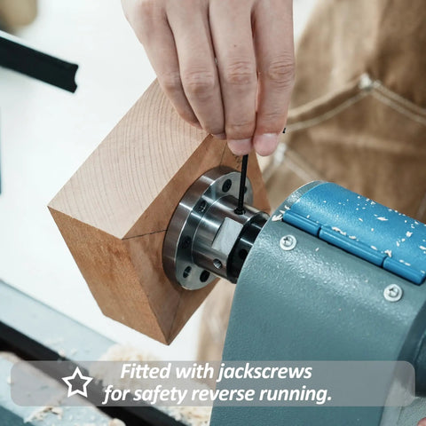Hand tightening screws on a 3 Inch Steel Wood Lathe Face Plate With 8 Screw Holes For Easy Mounting On 1x8 TPI Spindle Includes 8 M6 Screws Heavy Duty Lathe Accessory For Turning Wood Projects, attached to a wooden block.