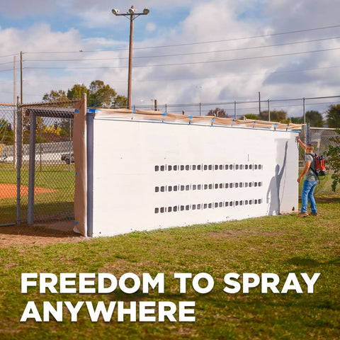 Tough As Nails 18V Cordless Airless Paint Sprayer With Advanced HEA Tech being used to paint a fence.