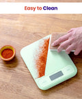 Reliable 5000 G Digital Kitchen Scale With 1 G Precision, Tare Function, And Multi Unit Readouts Including Oz, Lb Oz, Fl Oz, G, And Ml, Big Easy To Read Display For Quick Everyday Cooking Prep, mint scale being wiped clean