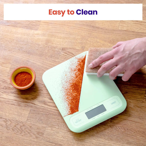 Reliable 5000 G Digital Kitchen Scale With 1 G Precision, Tare Function, And Multi Unit Readouts Including Oz, Lb Oz, Fl Oz, G, And Ml, Big Easy To Read Display For Quick Everyday Cooking Prep, mint scale being wiped clean