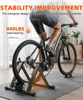Person using Foldable Magnetic Indoor Bike Trainer With Wheel Riser Block, Six-Level Resistance in living room setup
