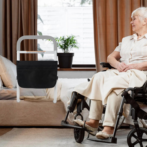 Adjustable bed assist rail for seniors with foam handle near bed and elderly woman in wheelchair, non-slip base and storage bag, gray.