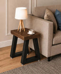 Small side table with 16 Inch Trapezoid Metal Table Legs Set Of 2 Beefy, Heavy Duty Black DIY Furniture Feet next to a sofa