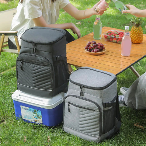 Kickass Heavy Duty Insulated Cooler Backpack With Leakproof Thermal Core And Adjustable Padded Straps For Camping Beach Hiking Keeps Snacks Ice Cold No Sweat, placed beside cooler, vibrant picnic setup.
