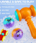 Plastic toy hammer with light-up balls and mini car from Two In One Rolling Ball And Car Ramp Race Track For Toddlers With Sensor Lights.