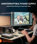 Person using Go Anywhere 512Wh LiFePO4 Portable Power Station With 500W Continuous Power And 1000W Peak at a desk for backup power.