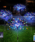 Four Pack Solar Garden Lights With 120 LED Copper Wire Waterproof Fireworks Design Flexible Stakes For Pathway And Lawn Remote Included 8 Modes Colorful Glow For Outdoor Backyard Ambiance displayed at night.