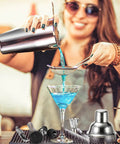 Woman using Ultimate Cocktail Shaker Set For Home Bartenders 18 8 Stainless Steel Mixology Kit With Bamboo Stand 10Piece Bar Tools