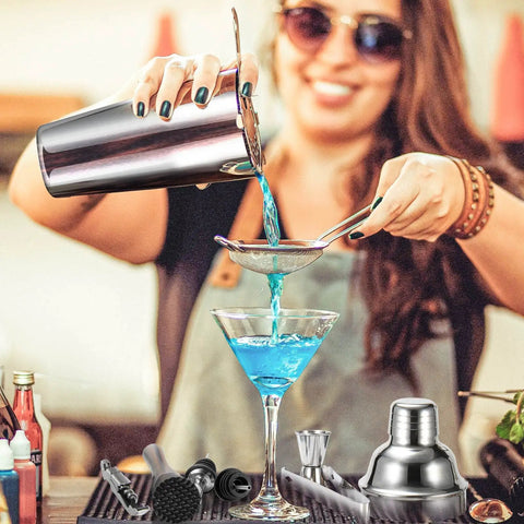 Woman using Ultimate Cocktail Shaker Set For Home Bartenders 18 8 Stainless Steel Mixology Kit With Bamboo Stand 10Piece Bar Tools