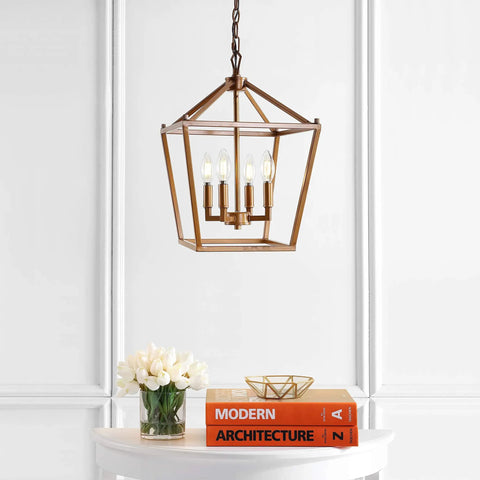 Kickstart Your Space With This Totally Rad Antique Gold 4 Light Pendant Ceiling Fixture Featuring A 12 Inch Caged Lantern Design above a table with books and flowers.