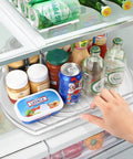 Refrigerator Square Lazy Susan Turntable Organizer in use, holding jars and bottles, clear 16.5x11.1 inch with non-slip base.