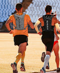 Runners wearing ultra lightweight hydration vest backpack with 1.5L insulated water bladder, gray, for races and marathons, back view
