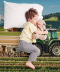 Child sleeping on Milk Farm Flannel Throw Blanket 55x70 Inch Cozy Soft Lightweight Plush with cows in background.