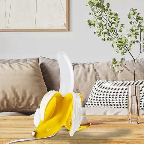 Dope Banana Table Lamp With LED Night Light on wooden table, modern resin banana lighting fixture with frosted acrylic shade