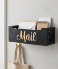 Wood Wall Mount Mail Organizer Keeps Envelopes Bills Letters And Cards Neatly In One Sweet Spot Ideal Home Office Storage Eleven Point Zero Two By Three Point Nine Four Inches Modern Minimalist Desk Box, showing a black wood mail holder with "Mail" text, mounted on a white wall above a hook with a bag.