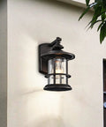 100W Max Vintage Farmhouse Outdoor Wall Light with Oil Rubbed Bronze Finish mounted on exterior wall, showing seedy glass