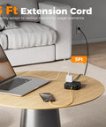 All-In-One Surge Protector Power Strip With 900J Surge Protection, 8 AC Outlets Plus USB C and USB A Ports, 5 Ft Flat Plug, 1250W Max, 11 Devices Charging Station, Black on living room table