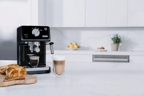 Straight Fire 15 Bar Espresso Machine With Adjustable Steam Wand And Manual Frothing System For Rich Lattes And Quick Shots In Sleek Stainless Steel Finish with latte in glass.