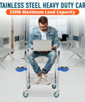 Man sitting on Improved Medical Stainless Steel Two Tier Rolling Cart With Wheels And Drawers for dental clinics and hospitals
