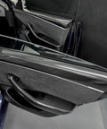 Autoclave Pressed Real Dry Carbon Fiber Door Panel Overlays Fits Tesla Model 3 Highland And Model Y Slick Matte 4 Piece Trim Kit installed on car door.