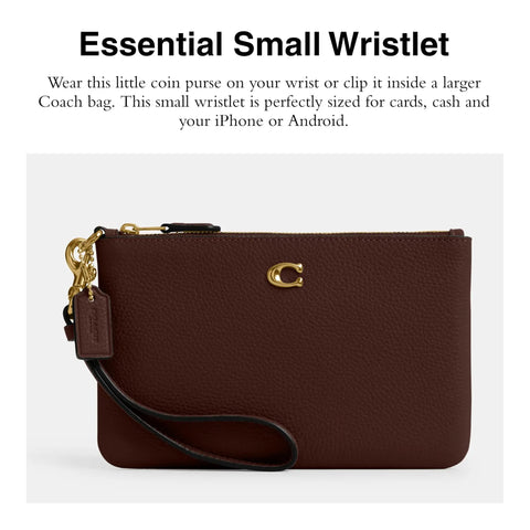 Top Shelf Small Wristlet Crafted From Smooth Pebble Leather With Signature Hardware And Detachable Strap For Phone Cash Cards Everyday Carry Clean Fit Women Fashion Clutch Case in burgundy view with wrist strap.