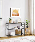 Hella Sturdy Industrial Console Table With Three Tier Open Shelving Slick Black Metal Frame And Rustic Brown Wood Top For Narrow Entryways Hallways Behind Sofa Spots Badass Home Decor Picks in a bright entryway with plants.