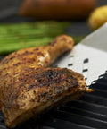 16-Inch Stainless Steel Tong And Turner Combo With Red Soft Grip Inserts lifting grilled chicken