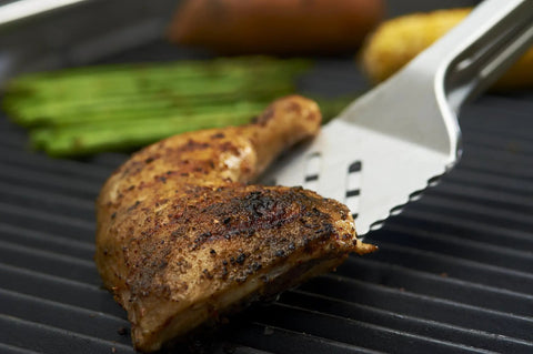 16-Inch Stainless Steel Tong And Turner Combo With Red Soft Grip Inserts lifting grilled chicken