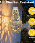 Outdoor Solar Crystal Pendant Lantern Chandelier hanging in the rain, showcasing waterproof feature with warm white LED glow.