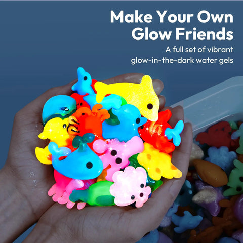 Hands holding colorful sea creature gels from Glow In The Dark Water Gel Kit For Kids with Ten Gels Twelve Sea Creature Molds