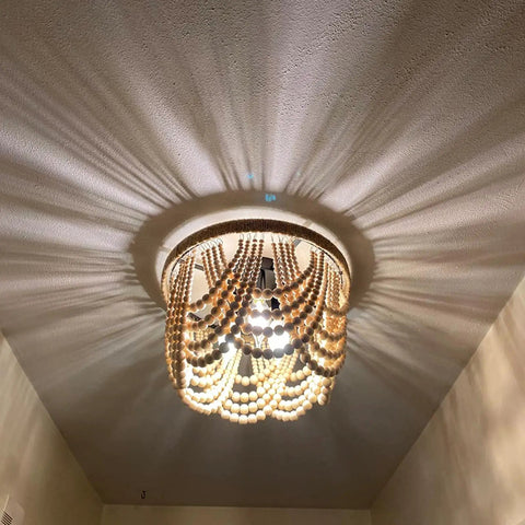 Boho Wood Beaded Chandelier 3 Light Semi Flush Mount Oak White Finish Mini Chandelier casting light pattern on ceiling