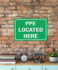 Built Tough PPE Storage Warning Sign 8 By 12 Inch Outdoor Aluminum Safety Marker Job Site Ready Weatherproof Plate mounted on brick wall.