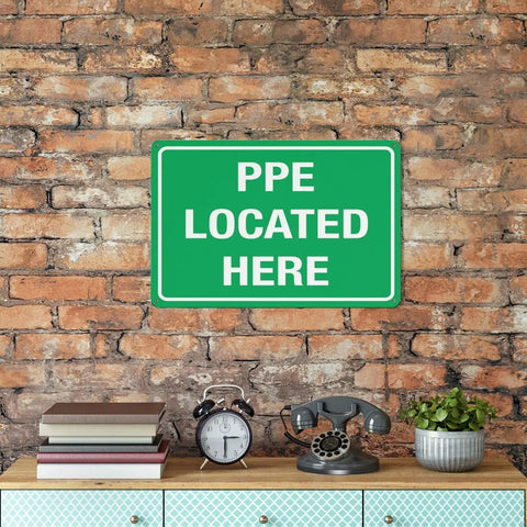 Built Tough PPE Storage Warning Sign 8 By 12 Inch Outdoor Aluminum Safety Marker Job Site Ready Weatherproof Plate mounted on brick wall.