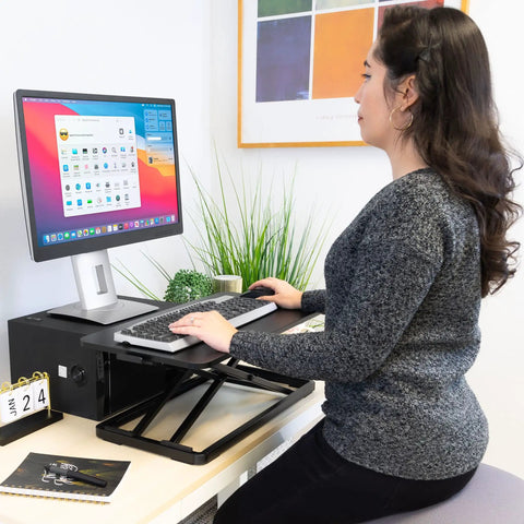 Person using Sit Stand Keyboard Tray For Desk With Height Adjustable Riser and Large 23.6x11.8 Surface at office desk