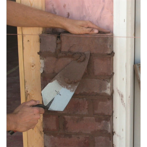 Philadelphia Style Brick Trowel With DuraSoft Handle For Brickwork Blockwork And Stonework, 11 X 5 And A Half Inch in use