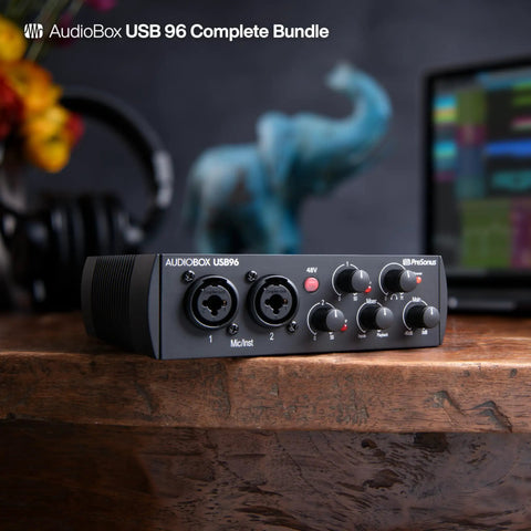 USB Audio Interface 2x2 Bundle With Studio One Pro, front view showing controls on a wooden desk setup for home studio use.