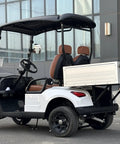 Pull Up In Style With This Badass Two Seater Golf Cart Featuring A Rock Solid Aluminum Cargo Bed 48V Lithium Battery Epic 4Kw Motor Sweet Directional Handling And Vibrant Yellow Paint For Total Neighborhood Dominance with brown seats and aluminum cargo.