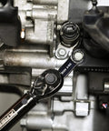 Using 8-Piece SAE 12-Point Box End Torque Adapter Extension Set on engine bolt, Chrome Vanadium Steel adapter in action