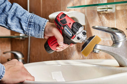 Person using 12V Cordless Mini Polisher and Drill Driver Combo Kit With Three Inch Polisher on bathroom faucet
