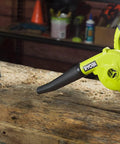 Heavy Duty 18V Cordless Workshop Blower For Slick Dust Sweep And Sawdust Cleanup With Triple Power Settings on wooden surface.