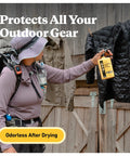Person spraying black jacket with Twin Pack Premium Permethrin Clothing Insect Repellent Trigger Spray 24 oz yellow bottle.