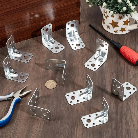 Pack Of Sixty Two By Two Inch Steel L Brackets For Wood Heavy Duty Ninety Degree Angle Corner Braces For Diy Furniture Repair laid out on a wooden table.