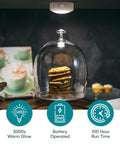 Battery Powered Under Cabinet Lights With Tap Technology illuminating cookies under glass dome on kitchen counter